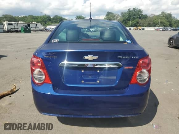 2012 Chevrolet Sonic LTZ z VIN 1G1JE5SB4C4213587, wystawiony jako Copart lot #63077975 z przebiegiem Nie podano mil oraz Szkoda całkowita • Salvage title. Historia ofert i sprzedaży dostępna na DreamBid. Obrazek 6.