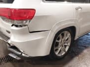 ✅ 2014 Jeep Grand Cherokee Summit • VIN: 1C4RJFJT7EC249398 • Lot: 43241993. Listed on IAAI with 115,708 mi. Free auction sales archive from the USA and detailed vehicle history report at DreamBid. Image 20.