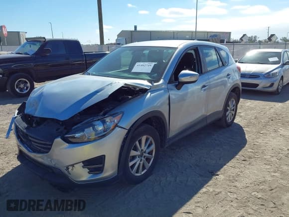 ✅ 2016 Mazda CX-5 Sport • VIN: JM3KE2BE9G0915168 • Lot: 41482749. Wystawiony na IAAI z przebiegiem 86 802 mil. Bezpłatny archiwum sprzedaży aukcyjnych z USA i szczegółowy raport historii pojazdu na DreamBid. Zdjęcie 2.