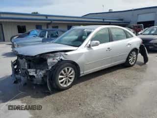 2007 Hyundai Azera SE z VIN KMHFC46F27A242907, wystawiony jako Copart lot #75424854 z przebiegiem 151 576 mil mil oraz Szkoda całkowita • Salvage title. Historia ofert i sprzedaży dostępna na DreamBid. Obrazek 1.