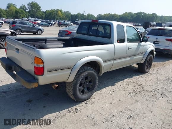 ✅ 2003 Toyota Tacoma • VIN: 5TEWM72N03Z249726 • Lot: 42947453. Listed on IAAI with 190,971 mi. Free auction sales archive from the USA and detailed vehicle history report at DreamBid. Image 4.