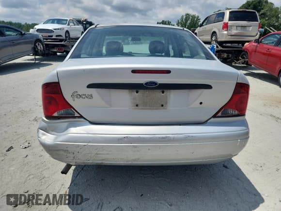 ✅ 2004 Ford Focus LX • VIN: 1FAFP33P44W149486 • Lot: 64574755. Wystawiony na Copart z przebiegiem 129 681 mil. Bezpłatny archiwum sprzedaży aukcyjnych z USA i szczegółowy raport historii pojazdu na DreamBid. Zdjęcie 6.