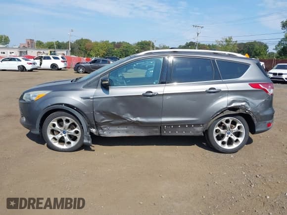 ✅ 2013 Ford Escape Titanium • VIN: 1FMCU9J99DUB51397 • Lot: 43286662. Listed on IAAI with 133,274 mi. Free auction sales archive from the USA and detailed vehicle history report at DreamBid. Image 14.
