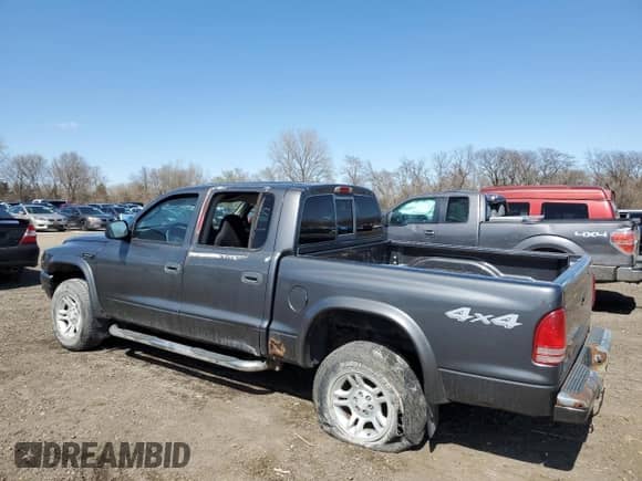 2003 Dodge Dakota Sport z VIN 1D7HG38N13S101403, wystawiony jako Copart lot #50814875 z przebiegiem 15 396 mil mil oraz Czysty tytuł • Clean title. Historia ofert i sprzedaży dostępna na DreamBid. Obrazek 2.