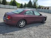 ✅ 2003 Oldsmobile Aurora • VIN: 1G3GS64C134163544 • Lot: 58706705. Listed on Copart with 104,447 mi. Free auction sales archive from the USA and detailed vehicle history report at DreamBid. Image 3.