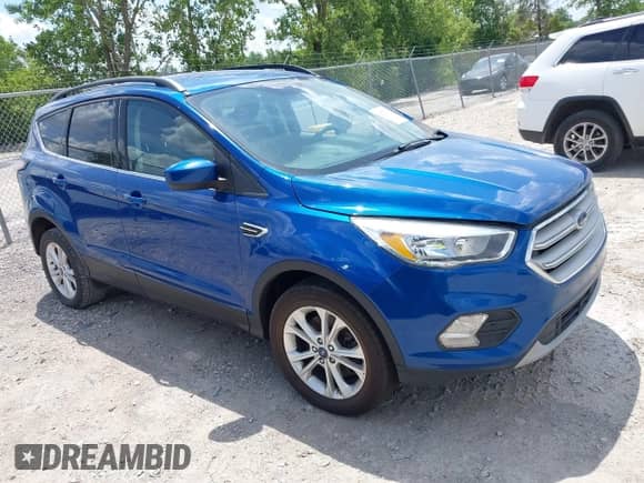 2018 Ford Escape SE z VIN 1FMCU9GD9JUA71170, wystawiony jako IAAI lot #42573258 z przebiegiem 102 170 mil mil oraz . Historia ofert i sprzedaży dostępna na DreamBid. Obrazek 1.