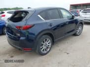 ✅ 2021 Mazda CX-5 Grand Touring Reserve • VIN: JM3KFBAY5M0425671 • Lot: 42341700. Listed on IAAI with 44,450 mi. Free auction sales archive from the USA and detailed vehicle history report at DreamBid. Image 4.