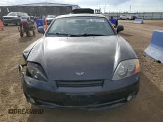 2004 Hyundai Tiburon GT с VIN KMHHN65F54U112663, выставлен на аукционе Copart как лот 60543975 с пробегом 51 589 миль миль и Списание • Salvage title. История ставок и продаж доступна на DreamBid. Изображение 5.