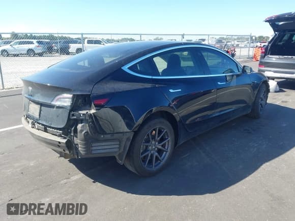 ✅ 2018 Tesla Model 3 Long Range Battery • VIN: 5YJ3E1EA5JF173389 • Lot: 43404293. Listed on IAAI with 106,789 mi. Free auction sales archive from the USA and detailed vehicle history report at DreamBid. Image 4.