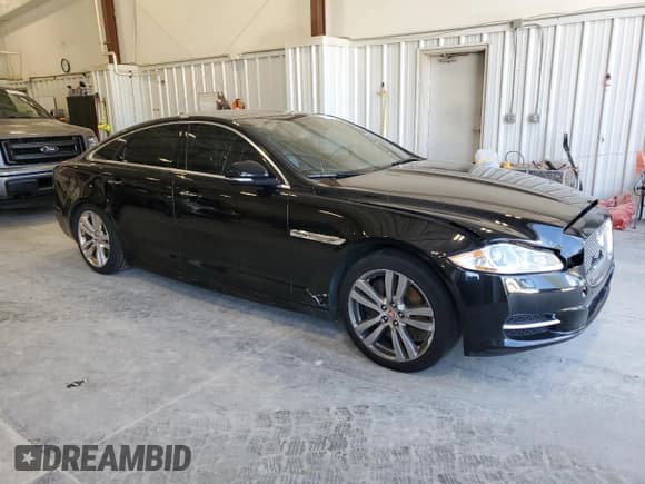 ✅ 2015 Jaguar XJ • VIN: SAJWJ1CDXF8V85631 • Lot: 70191865. Listed on Copart with 130,058 mi. Free auction sales archive from the USA and detailed vehicle history report at DreamBid. Image 4.