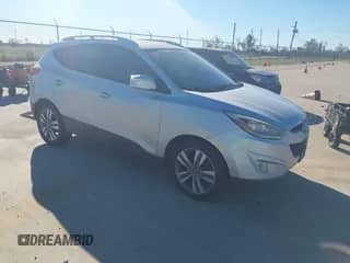 2014 Hyundai Tucson Limited with VIN KM8JU3AG3EU890012, listed as a IAAI auction lot 43577338 with 127,044 mi miles and . Bid and sale history available at DreamBid. Image 1.