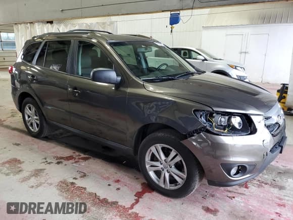 ✅ 2012 Hyundai Santa Fe SE • VIN: 5XYZH4AG6CG135162 • Lot: 79197764. Listed on Copart with 87,661 mi. Free auction sales archive from the USA and detailed vehicle history report at DreamBid. Image 4.