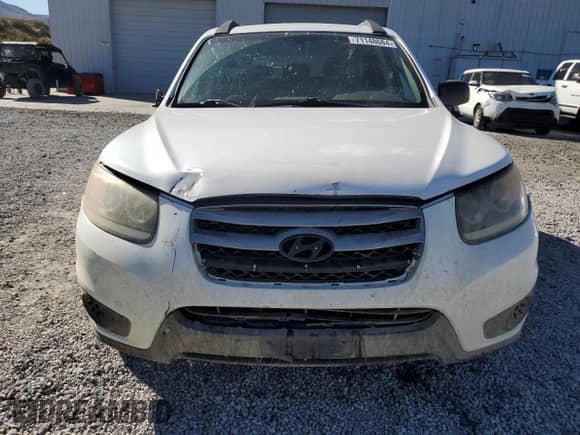 2012 Hyundai Santa Fe GLS с VIN 5XYZGDAB3CG151441, выставлен на аукционе Copart как лот 71148684 с пробегом Не указан миль и Списание • Salvage title. История ставок и продаж доступна на DreamBid. Изображение 5.