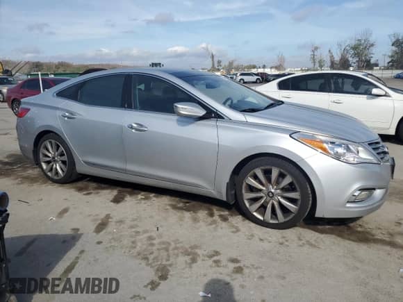 2014 Hyundai Azera Limited с VIN KMHFH4JG0EA353390, выставлен на аукционе Copart как лот 42502275 с пробегом 105 868 миль миль и Списание • Salvage title. История ставок и продаж доступна на DreamBid. Изображение 4.