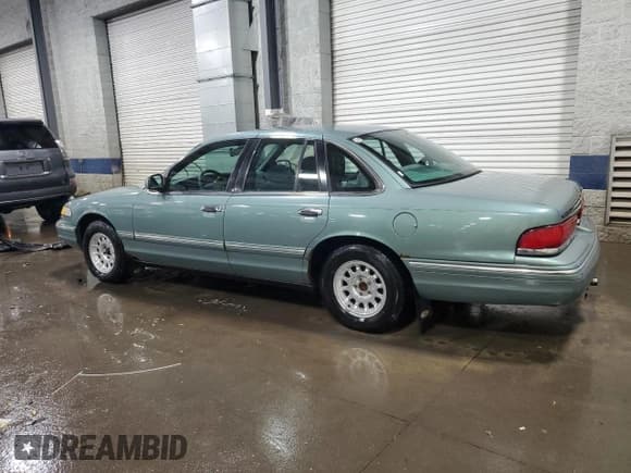 ✅ 1997 Ford Crown Victoria LX • VIN: 2FALP74W8VX231100 • Lot: 46806545. Listed on Copart with 156,739 mi. Free auction sales archive from the USA and detailed vehicle history report at DreamBid. Image 2.