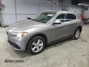 ✅ 2018 Alfa Romeo Stelvio • VIN: ZASFAKAN7J7C01195 • Lot: 82287485. Listed on Copart with 62,431 mi. Free auction sales archive from the USA and detailed vehicle history report at DreamBid. Image 1.