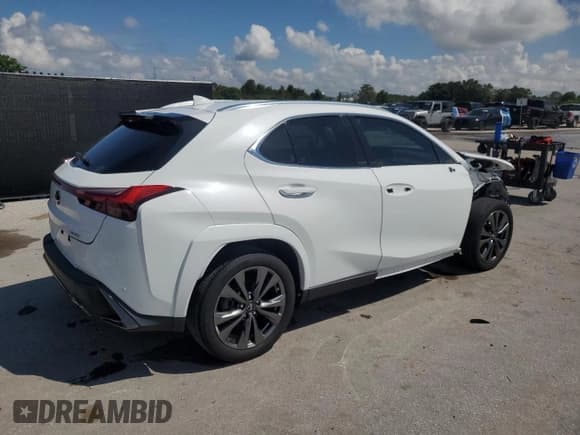 ✅ 2022 Lexus UX 200 F Sport • VIN: JTHE3JBH6N2055584 • Лот: 71727835. Опубликован ранее на Copart с пробегом 28 871 миль. Бесплатный доступ к архиву аукционных продаж из США и подробный отчёт об истории автомобиля на DreamBid. Изображение 3.