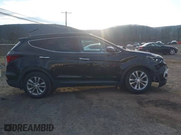 2017 Hyundai Santa Fe 2.0T z VIN 5XYZUDLA8HG502333, wystawiony jako IAAI lot #41246195 z przebiegiem 62 772 mil mil oraz . Historia ofert i sprzedaży dostępna na DreamBid. Obrazek 13.