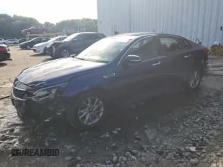 ✅ 2019 Kia Optima LX • VIN: 5XXGT4L31KG312848 • Лот: 65795315. Опубликован ранее на Copart с пробегом 128 411 миль. Бесплатный доступ к архиву аукционных продаж из США и подробный отчёт об истории автомобиля на DreamBid. Изображение 1.