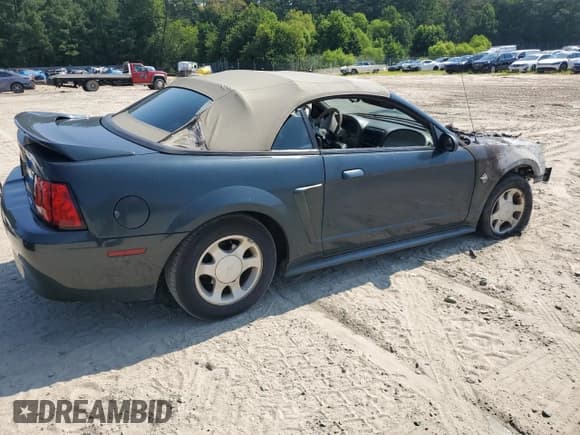 ✅ 1999 Ford Mustang • VIN: 1FAFP4446XF140819 • Lot: 65761395. Listed on Copart with Not provided. Free auction sales archive from the USA and detailed vehicle history report at DreamBid. Image 3.