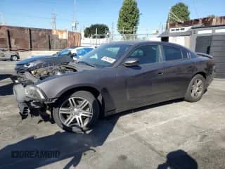 ✅ 2014 Dodge Charger Road/Track • VIN: 2C3CDXCT0EH330258 • Lot: 90421655. Listed on Copart with 114,910 mi. Free auction sales archive from the USA and detailed vehicle history report at DreamBid. Image 1.