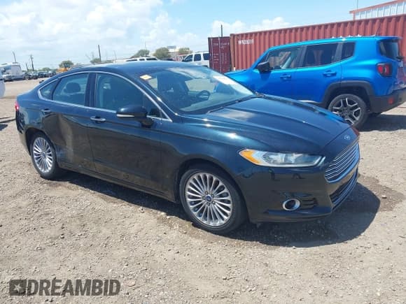 ✅ 2014 Ford Fusion Titanium • VIN: 3FA6P0K98ER208478 • Lot: 42944842. Wystawiony na IAAI z przebiegiem 63 684 mil. Bezpłatny archiwum sprzedaży aukcyjnych z USA i szczegółowy raport historii pojazdu na DreamBid. Zdjęcie 1.