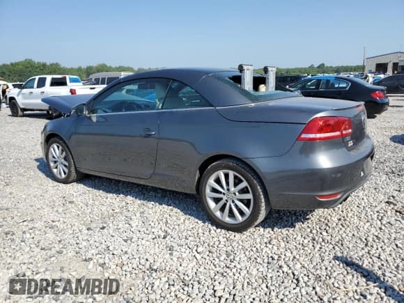✅ 2015 Volkswagen Eos Komfort • VIN: WVWBW8AH9FV001489 • Лот: 68965725. Опубликован ранее на Copart с пробегом 98 038 миль. Бесплатный доступ к архиву аукционных продаж из США и подробный отчёт об истории автомобиля на DreamBid. Изображение 2.