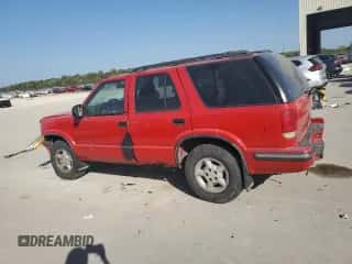 1999 Chevrolet Blazer LS z VIN 1GNDT13WXX2244937, wystawiony jako Copart lot #74332364 z przebiegiem Nie podano mil oraz Szkoda całkowita • Salvage title. Historia ofert i sprzedaży dostępna na DreamBid. Obrazek 2.