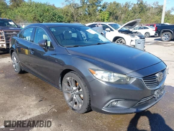 ✅ 2015 Mazda 6 i Grand Touring • VIN: JM1GJ1W58F1196602 • Lot: 43645713. Listed on IAAI with 114,609 mi. Free auction sales archive from the USA and detailed vehicle history report at DreamBid. Image 1.