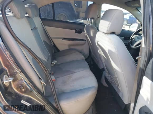 2011 Hyundai Accent GLS z VIN KMHCN4AC1BU606400, wystawiony jako Copart lot #76609004 z przebiegiem 226 486 mil mil oraz Szkoda całkowita • Salvage title. Historia ofert i sprzedaży dostępna na DreamBid. Obrazek 10.