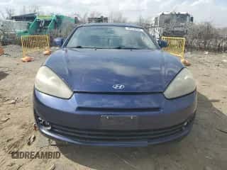2007 Hyundai Tiburon GT z VIN KMHHN66F57U251906, wystawiony jako Copart lot #48970455 z przebiegiem 155 519 mil mil oraz Szkoda całkowita • Salvage title. Historia ofert i sprzedaży dostępna na DreamBid. Obrazek 5.