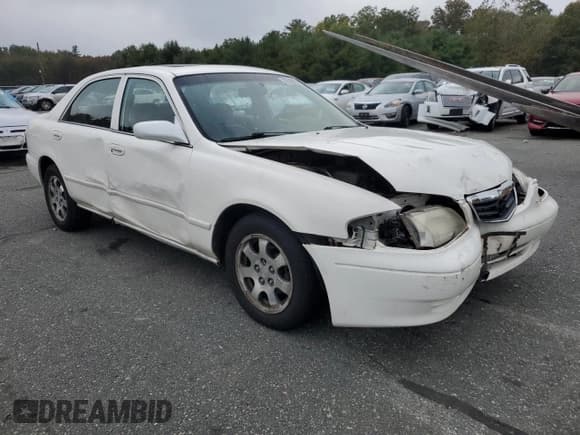 ✅ 2000 Mazda 626 LX • VIN: 1YVGF22CXY5112958 • Lot: 72740904. Listed on Copart with 111,581 mi. Free auction sales archive from the USA and detailed vehicle history report at DreamBid. Image 4.