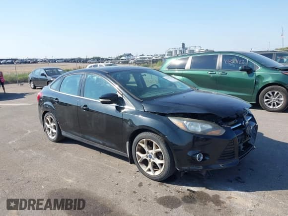 ✅ 2014 Ford Focus Titanium • VIN: 1FADP3J23EL237429 • Lot: 43358765. Listed on IAAI with 138,960 mi. Free auction sales archive from the USA and detailed vehicle history report at DreamBid. Image 1.