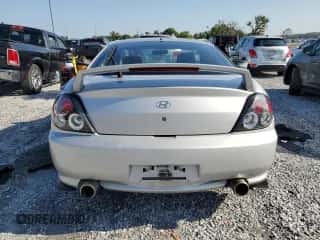 2004 Hyundai Tiburon GT с VIN KMHHN65F94U153507, выставлен на аукционе Copart как лот 66108085 с пробегом 113 413 миль миль и Списание • Salvage title. История ставок и продаж доступна на DreamBid. Изображение 6.