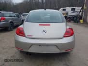 ✅ 2013 Volkswagen Beetle 2.5L • VIN: 3VWJP7AT2DM601962 • Lot: 43729443. Listed on IAAI with 84,556 mi. Free auction sales archive from the USA and detailed vehicle history report at DreamBid. Image 16.