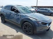 ✅ 2022 Mazda CX-30 S Carbon Edition • VIN: 3MVDMBCL6NM410330 • Lot: 42107426. Listed on IAAI with 30,277 mi. Free auction sales archive from the USA and detailed vehicle history report at DreamBid. Image 1.