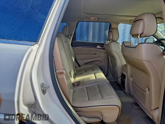 ✅ 2014 Jeep Grand Cherokee Overland • VIN: 1C4RJFCG2EC460377 • Lot: 93543155. Listed on Copart with 128,124 mi. Free auction sales archive from the USA and detailed vehicle history report at DreamBid. Image 11.