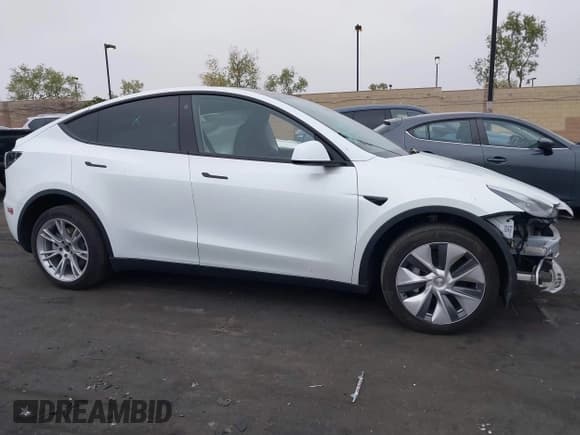 ✅ 2023 Tesla Model Y Long Range • VIN: 7SAYGDEE5PA063097 • Lot: 42171871. Listed on IAAI with Not provided. Free auction sales archive from the USA and detailed vehicle history report at DreamBid. Image 14.