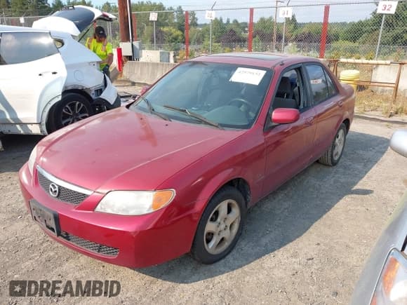 ✅ 2002 Mazda Protege DX • VIN: JM1BJ225520501057 • Lot: 42979132. Wystawiony na IAAI z przebiegiem 140 232 mil. Bezpłatny archiwum sprzedaży aukcyjnych z USA i szczegółowy raport historii pojazdu na DreamBid. Zdjęcie 2.