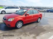 ✅ 2011 Kia Rio LX • VIN: KNADH4A37B6944224 • Lot: 41938334. Listed on IAAI with 116,116 mi. Free auction sales archive from the USA and detailed vehicle history report at DreamBid. Image 2.