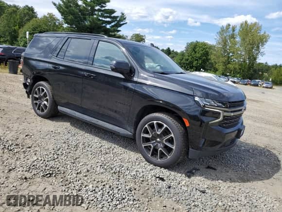 2022 Chevrolet Tahoe RST with VIN 1GNSKRKD0NR244846, listed as a Copart auction lot 70801855 with 69,403 mi miles and Salvage title. Bid and sale history available at DreamBid. Image 4.