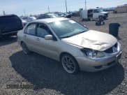 ✅ 2005 Mitsubishi Lancer ES • VIN: JA3AJ26E55U014748 • Lot: 41935566. Listed on IAAI with 255,336 mi. Free auction sales archive from the USA and detailed vehicle history report at DreamBid. Image 1.