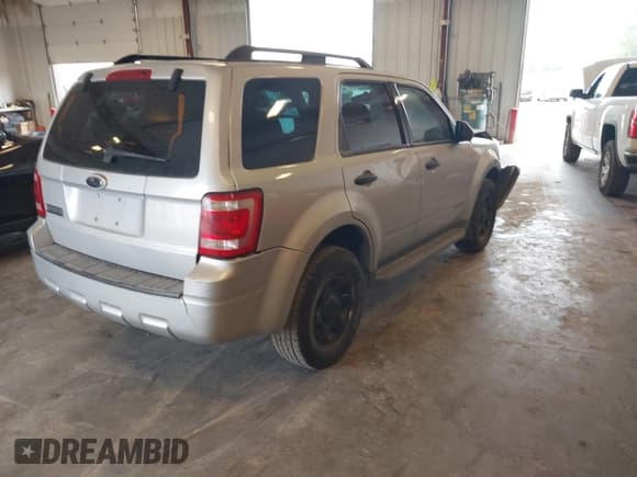 ✅ 2008 Ford Escape XLS • VIN: 1FMCU02Z48KE38724 • Lot: 43258506. Listed on IAAI with 118,965 mi. Free auction sales archive from the USA and detailed vehicle history report at DreamBid. Image 4.