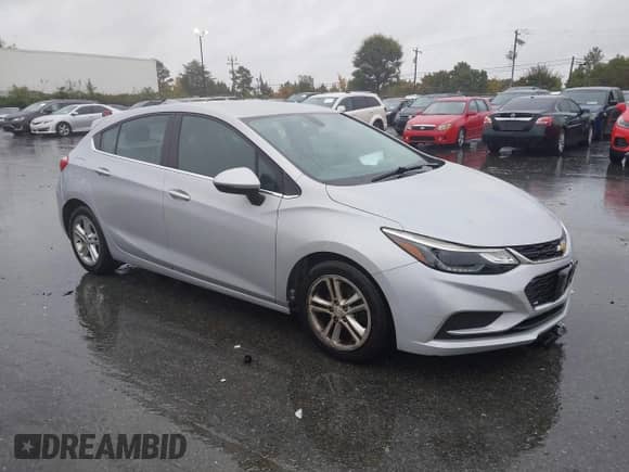 2017 Chevrolet Cruze LT z VIN 3G1BE6SMXHS582523, wystawiony jako IAAI lot #43559534 z przebiegiem 105 496 mil mil oraz . Historia ofert i sprzedaży dostępna na DreamBid. Obrazek 1.