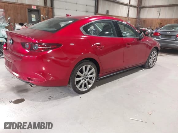 ✅ 2021 Mazda 3 • VIN: JM1BPBDL0M1334811 • Lot: 43777630. Listed on IAAI with 57,584 mi. Free auction sales archive from the USA and detailed vehicle history report at DreamBid. Image 4.