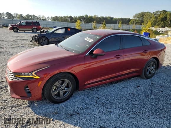 ✅ 2023 Kia K5 LXS • VIN: 5XXG14J27PG196207 • Lot: 82151965. Wystawiony na Copart z przebiegiem 69 769 mil. Bezpłatny archiwum sprzedaży aukcyjnych z USA i szczegółowy raport historii pojazdu na DreamBid. Zdjęcie 1.