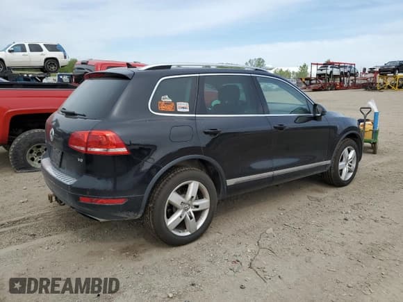 ✅ 2012 Volkswagen Touareg Sport • VIN: WVGFF9BP8CD001039 • Лот: 57764125. Опубликован ранее на Copart с пробегом 128 540 миль. Бесплатный доступ к архиву аукционных продаж из США и подробный отчёт об истории автомобиля на DreamBid. Изображение 3.