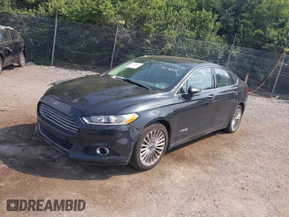 ✅ 2014 Ford Fusion Titanium Hybrid • VIN: 3FA6P0RUXER191158 • Lot: 42815287. Wystawiony na IAAI z przebiegiem 162 415 mil. Bezpłatny archiwum sprzedaży aukcyjnych z USA i szczegółowy raport historii pojazdu na DreamBid. Zdjęcie 2.