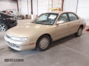 ✅ 1994 Mazda 626 DX • VIN: 1YVGE22C7R5112212 • Лот: 42207980. Опубликован ранее на IAAI с пробегом 128 688 миль. Бесплатный доступ к архиву аукционных продаж из США и подробный отчёт об истории автомобиля на DreamBid. Изображение 2.