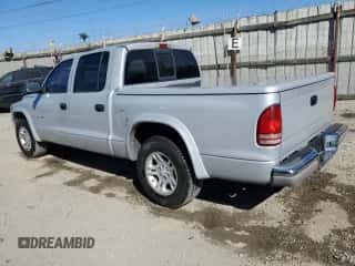 2002 Dodge Dakota SLT z VIN 1B7HL48X02S545545, wystawiony jako Copart lot #77478754 z przebiegiem 83 985 mil mil oraz Czysty tytuł • Clean title. Historia ofert i sprzedaży dostępna na DreamBid. Obrazek 2.